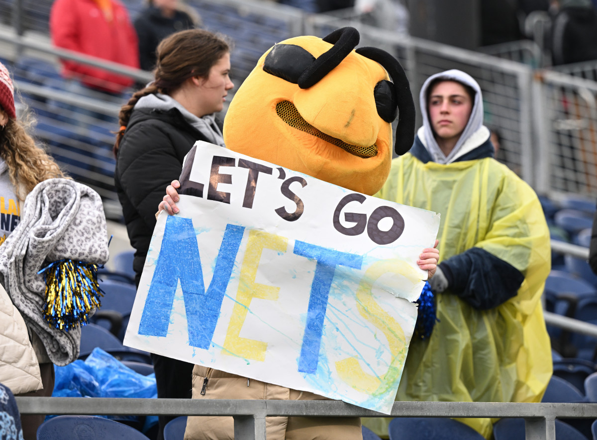 A student wearing hornet headgear cheers for Kirtland during the 2022 Division VI state championship game. Photo credit: Jeff Harwell, SBLive Sports